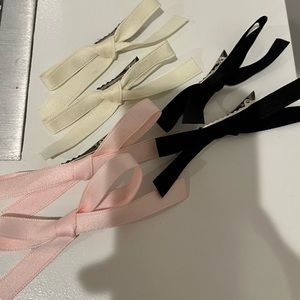 Bow tie hair clips in pink, white, and black